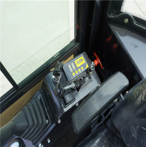 Control panel inside a vehicle with digital display and buttons.